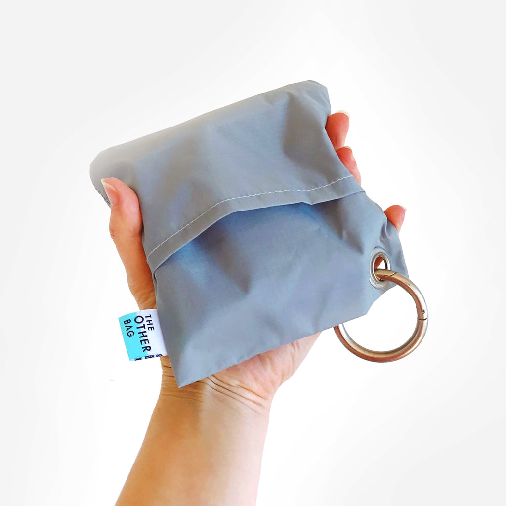 Econyl grey and aqua reusable shopping bag in pouch with ring