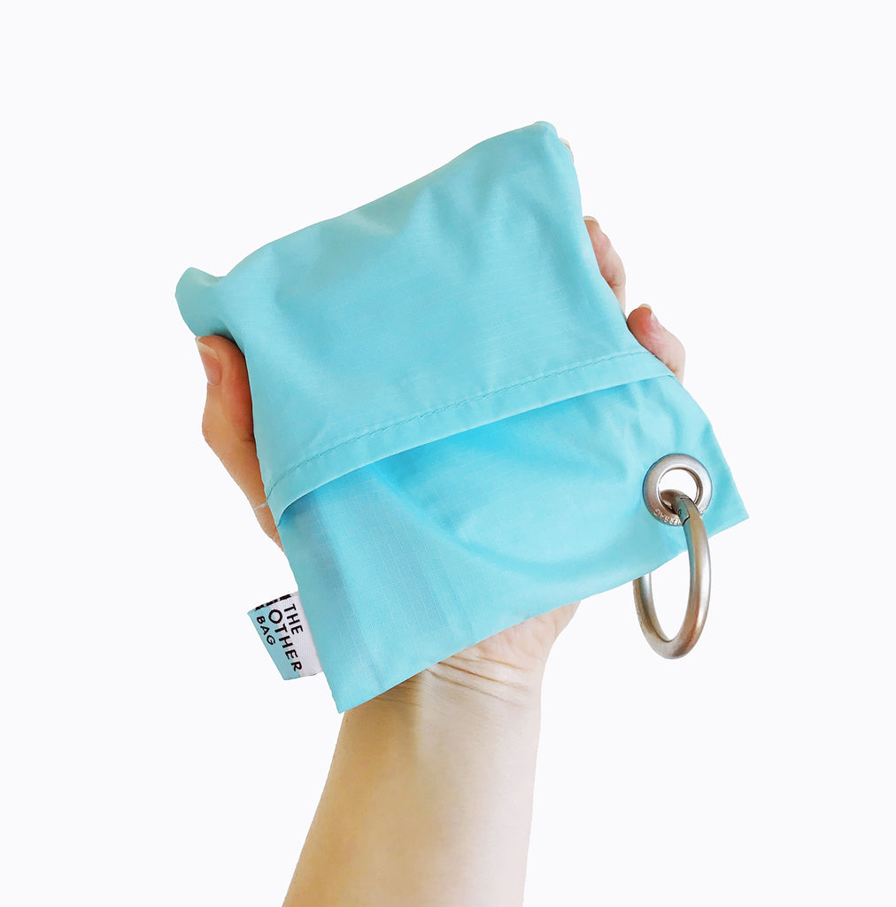 Aqua and Bondi blue foldable tote bag  made with Econyl® regenerated yarn