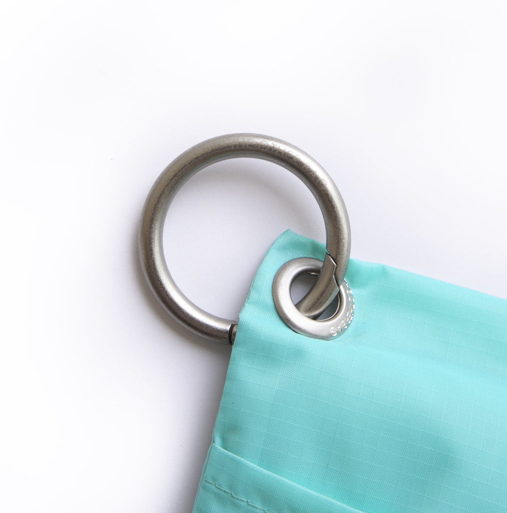 Clip ring attached to recycled tote bag pouch