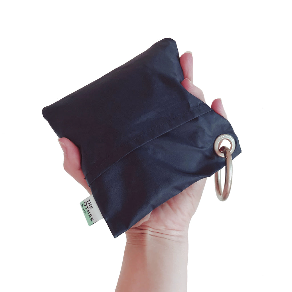 Econyl navy blue foldable sustainable tote bag in pouch