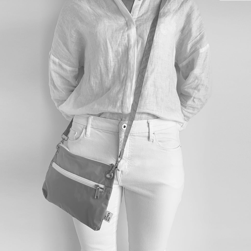 Grey crossbody bag made with Econyl® regenerated yarn