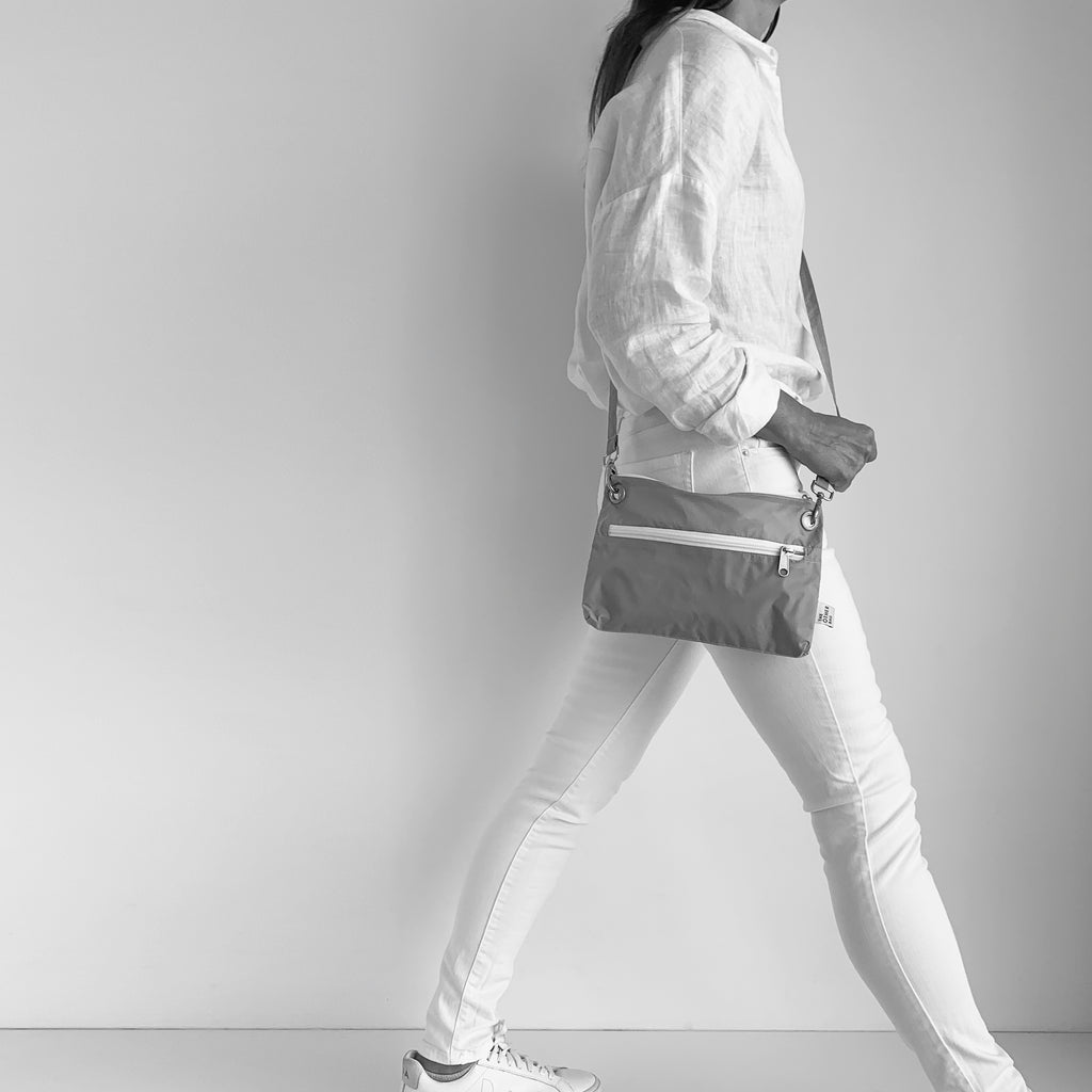 Grey crossbody bag made with Econyl® regenerated yarn